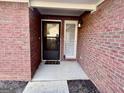 Close-up of the brick entryway showcasing the front door, sidelight window, and classic brick facade at 116 Glendale Dr, Peachtree City, GA 30269