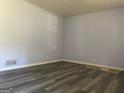 Freshly painted bedroom featuring sleek gray flooring and ample natural light at 266 Ridge Trl, Riverdale, GA 30274