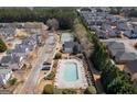 Aerial view of community pool, tennis court and surrounding houses at 4654 Liberty Square Dr, Acworth, GA 30101
