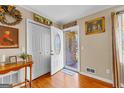 Welcoming entryway features wood flooring, a closet and a half-lite door with sidelights at 275 S Bethany Rd, Mcdonough, GA 30252