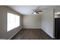Bright living room with wood flooring and a modern ceiling fan at 1751 Woodsloe Dr, Decatur, GA 30035