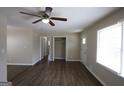Spacious living room featuring wood floors, neutral paint, and a ceiling fan at 1751 Woodsloe Dr, Decatur, GA 30035