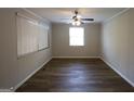 Comfortable bedroom featuring wood-look floors, bright light, and neutral wall paint at 2096 Dellwood Pl, Decatur, GA 30032