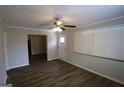 Well-lit living room featuring stylish wood flooring and a modern ceiling fan at 2096 Dellwood Pl, Decatur, GA 30032