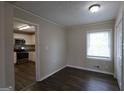 Cozy dining area with views into the updated kitchen and hardwood floors at 3065 Glendale Ct, Decatur, GA 30032