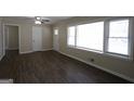 Bright living room with large windows and modern wood-look flooring at 3065 Glendale Ct, Decatur, GA 30032