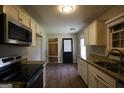 Spacious kitchen with modern appliances, granite countertops and plenty of cabinet space at 4044 Lindsey Dr, Decatur, GA 30035