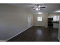Spacious living area featuring dark hardwood floors and modern ceiling fan at 3037 San Juan Dr, Decatur, GA 30032