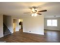 Bright living room featuring new flooring and a modern ceiling fan at 756 Sugar Hill Ln, Conyers, GA 30094