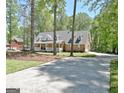 Brick home with a long driveway and mature trees at 315 Antebellum Way, Fayetteville, GA 30215
