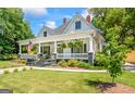 Beautiful front yard with a lush green lawn and landscaped garden beds leading up to the inviting front porch at 2173 Conyers Se St, Covington, GA 30014