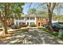 Charming townhomes featuring manicured lawns and convenient driveway parking at 5599 Fair Creek Way, Lithonia, GA 30038