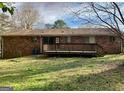 Home's backyard features a spacious deck and large grassy area at 2140 Indian Hill Rd, Jonesboro, GA 30236