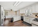 Spacious eat-in kitchen featuring white cabinetry, granite countertops, and stainless steel appliances at 4435 Ross Estates Ct, Snellville, GA 30039