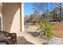 View of covered entryway with tiled flooring, quaint decor, and outdoor landscaping at 90 Hazelridge Ln, Sharpsburg, GA 30277