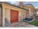 Side view of the garage with closed doors and ample storage space at 100 Cross Plains Hulett Rd, Carrollton, GA 30116