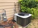 Exterior view of an air conditioning system with a gas meter and utilities at 3221 Rock Creek Dr, Rex, GA 30273