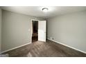 Bedroom has carpet, gray walls, white trim, closet, and a view of the stairway at 120 Gran De, Atlanta, GA 30349