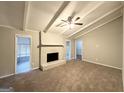 Spacious living room with painted brick fireplace, ceiling fan and access to the screened porch at 120 Gran De, Atlanta, GA 30349