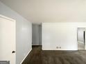 Spacious living room showcasing carpet floors and neutral-painted walls providing a blank canvas for personalization at 2087 John Wesley Ct, Decatur, GA 30035