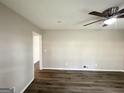 Bright living room featuring modern ceiling fan, wood flooring and neutral paint at 837 Needle Rock Dr, Stone Mountain, GA 30083