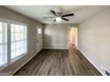 Bright living room with wood flooring, large windows, and natural light at 837 Needle Rock Dr, Stone Mountain, GA 30083