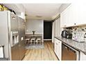 Eat-in kitchen features stainless steel appliances and a charming breakfast nook at 2900 Haddon Dr, Rex, GA 30273