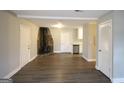 Inviting living room with wood-look floors, fireplace, and fresh paint at 5960 John St, Austell, GA 30106