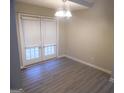 Cozy dining room featuring stylish lighting, and glass doors leading to the outdoors at 1742 Pine Fort Cir, Dacula, GA 30019