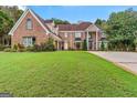 Beautiful two-story brick home with manicured lawn at 157 Glen Eagle Way, Mcdonough, GA 30253
