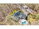 Expansive property featuring a swimming pool, patio, and ample parking at 313 Dingler Rd, Moreland, GA 30259