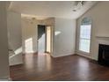 Inviting living room featuring a fireplace, vaulted ceiling, and hardwood floors at 40 Canterbury Dr, Grantville, GA 30220