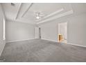 Expansive main bedroom with soft gray walls, plush carpet, and an en-suite bathroom at 60 Charlotte Blvd, Stockbridge, GA 30281