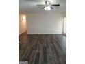 Spacious living room with wood-look flooring and a door leading to the outside at 1172 Sheffield Ct, Jonesboro, GA 30238