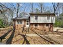 Traditional two-story home features brick and siding exterior with inviting front entrance and yard at 40 Derby Country Dr, Ellenwood, GA 30294