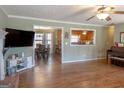Open floor plan featuring a hardwood floor, and view into the kitchen and dining area at 500 Hayfield Ct, Locust Grove, GA 30248