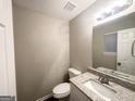 Clean bathroom features a modern vanity, new sink, and modern countertops at 2940 Highland Hill Pkwy, Douglasville, GA 30135