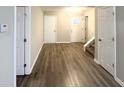Open-concept entryway features new flooring, stairs to upper level, and multiple entrances at 2940 Highland Hill Pkwy, Douglasville, GA 30135