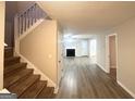 Spacious living room features hardwood floors, fireplace, and natural light at 2940 Highland Hill Pkwy, Douglasville, GA 30135