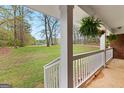 View from the porch features a large backyard with a peaceful view of nature at 1407 Highway 92 N, Fayetteville, GA 30214
