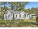 Charming single-story home featuring a well-maintained lawn and inviting front porch at 2069 Sandtown Sw Rd, Atlanta, GA 30311