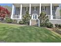Stone steps lead up to the front porch, adding a touch of elegance to this attractive home at 100 Smokerise Trce, Peachtree City, GA 30269