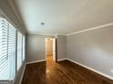 Bright bedroom with hardwood floors, crown molding, and neutral paint provides a serene living space at 3729 Glenwood Rd, Decatur, GA 30032