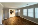 Inviting living room with hardwood floors, natural light and an open view into the modern kitchen at 3729 Glenwood Rd, Decatur, GA 30032