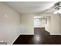 Neutral interior featuring dark hardwood floors and ceiling fan, offering a blank canvas for personalization at 4250 Timber Valley Ct, Decatur, GA 30032