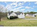 This single-Gathering home has an attached two-car garage, manicured lawn, and traditional architecture at 1416 Flanagan Mill Dr, Auburn, GA 30011
