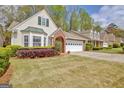 Attractive home with a spacious driveway and lush green lawn at 1010 Pinehurst Dr, Peachtree City, GA 30269