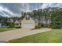 Well-maintained home with a spacious driveway, two-car garage, and lovely curb appeal at 116 Laurel Ln, Social Circle, GA 30025