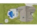 Backyard aerial showing a pool, spa, fire pit, outdoor seating and green space at 176 Butler Rd, Brooks, GA 30205
