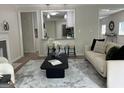 Cozy living space with contemporary decor, including a sleek coffee table and neutral-toned sofa at 1751 S Olympian Way, Atlanta, GA 30310